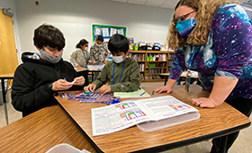  Beverly Campbell with two students